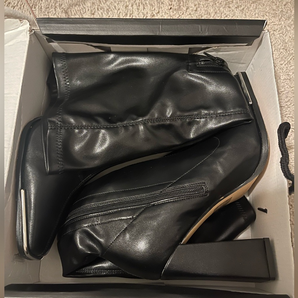 black leather high heel boots